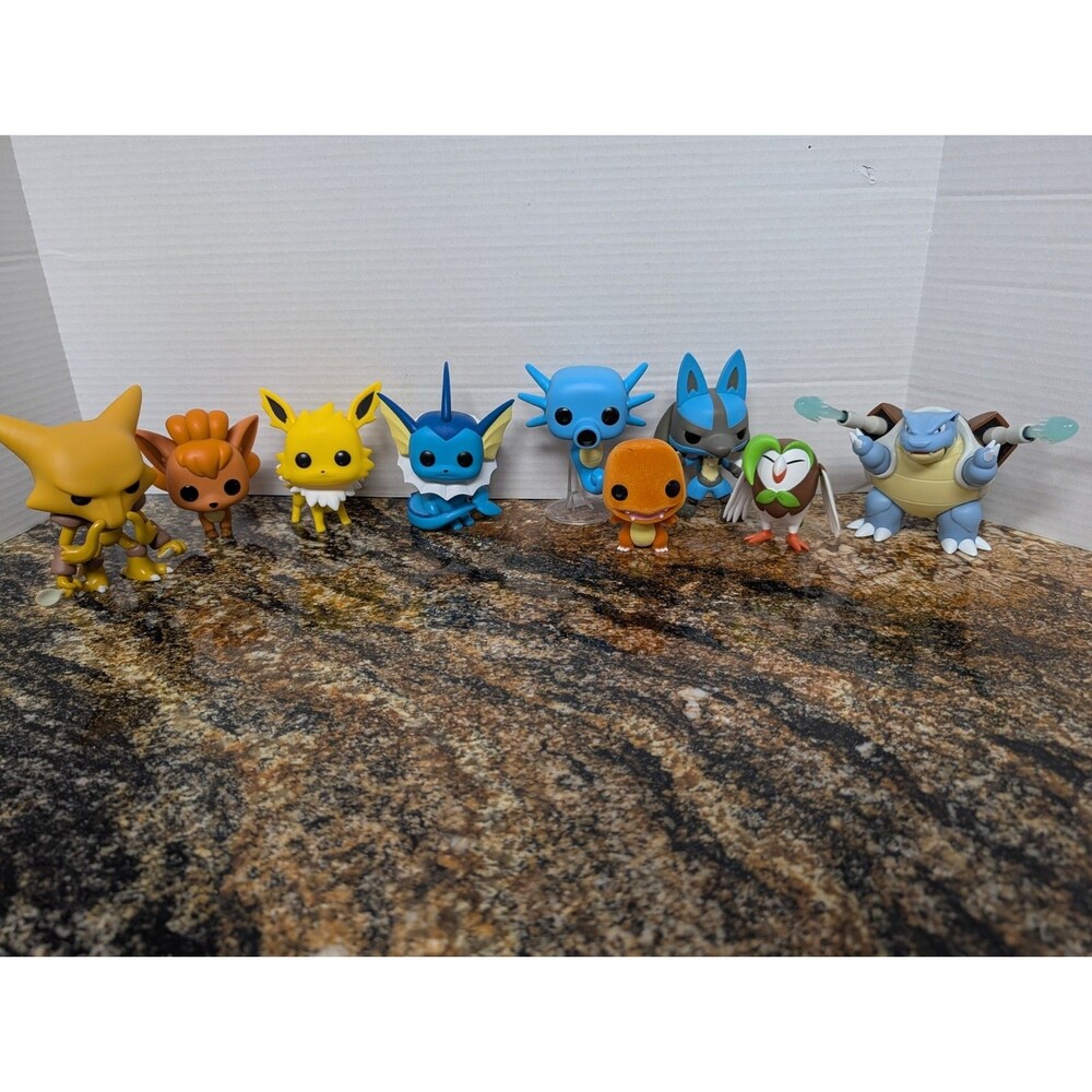 Lot Of Pokemon Funkos & Memorabilia